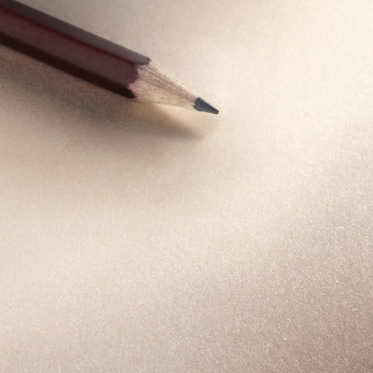 Hahnemühle cappuccino-coloured paper detail with a pencil